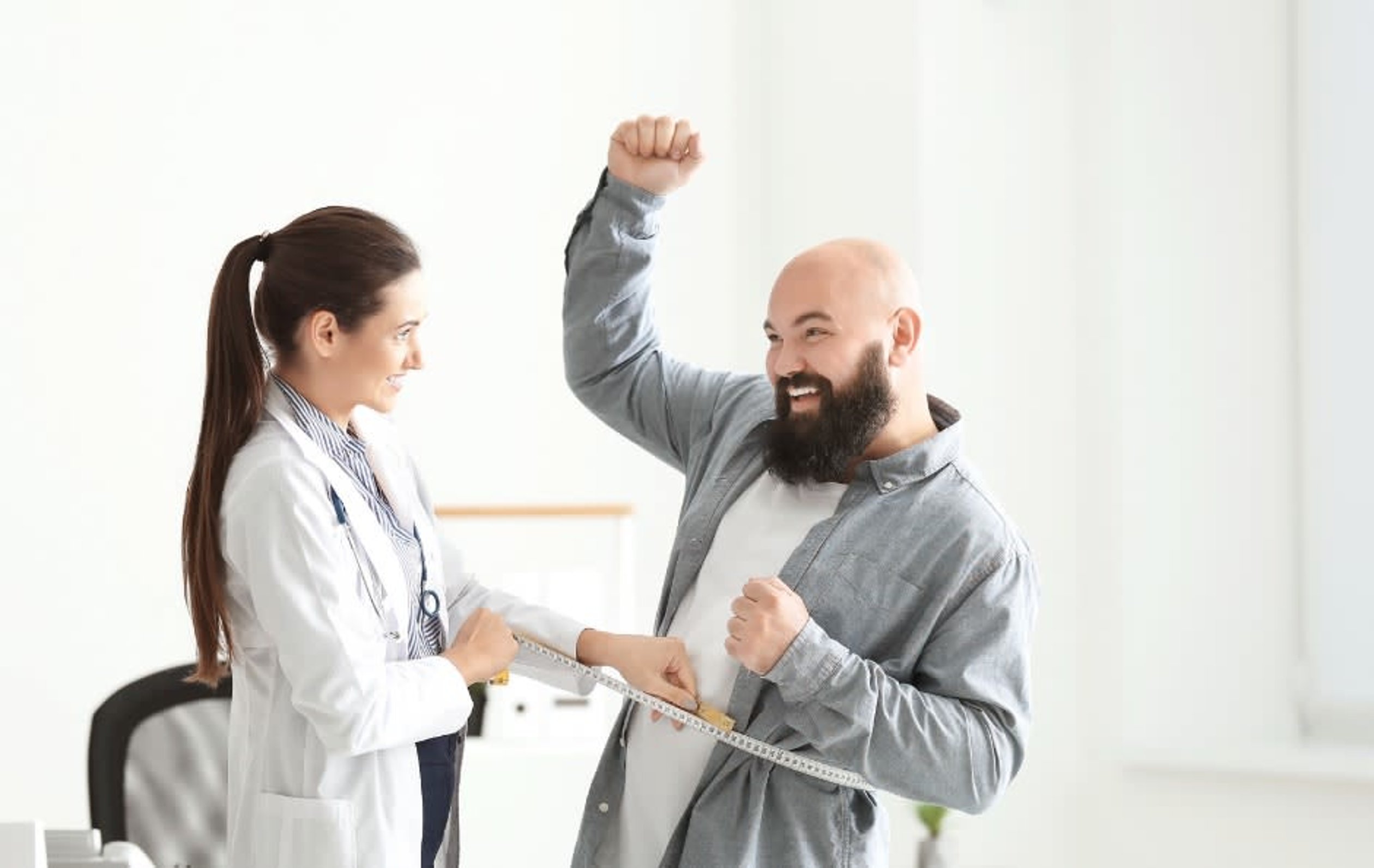 a man standing next to a woman