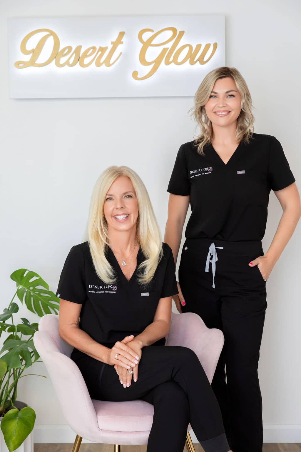 two people sitting posing for the camera